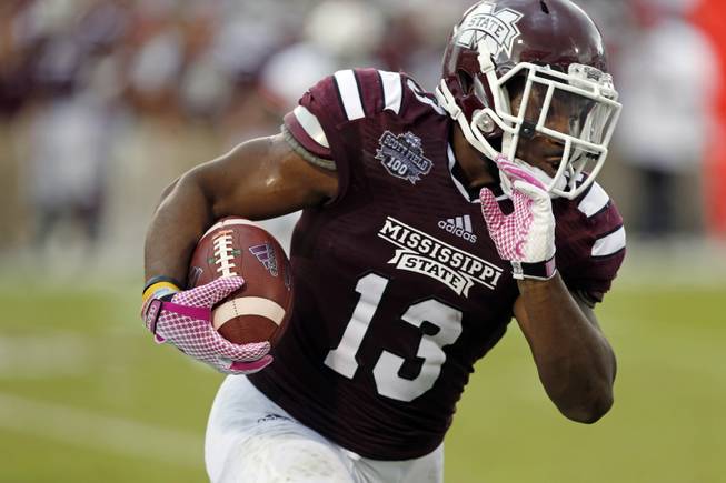 Mississippi State running back Josh Robinson (13) runs upfield during the first half of an NCAA college football game against Auburn in Starkville, Miss., Saturday, Oct 11, 2014. No.3 Mississippi State beat No. 2 Auburn 38-23. (AP Photo/Rogelio V. Solis)