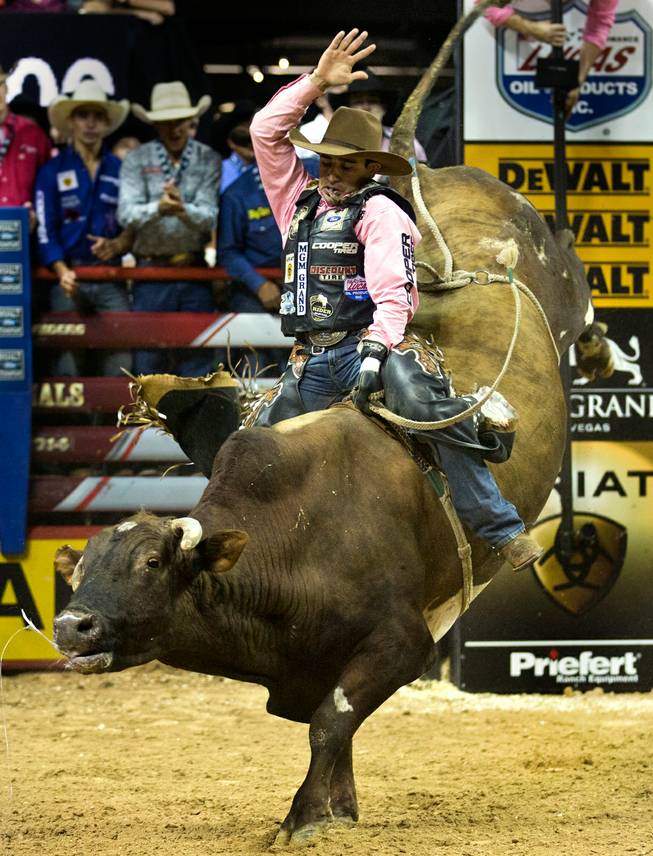 Silvano Alves stays calm atop of Mr. Clark during the PBR 2014 World Finals on Thursday, October 23, 2014. L.E. Baskow.