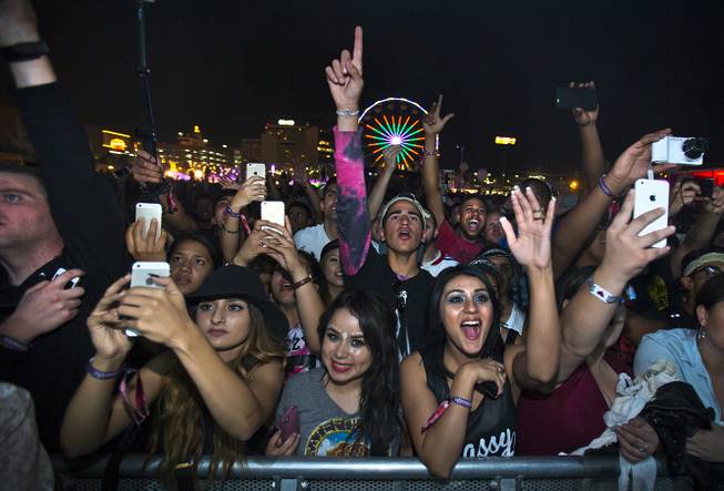 A crowd takes in a performance of The Weeknd at the Downtown Stage on the opening day of the Life Is Beautiful festival Friday, Oct. 24, 2014, in downtown Las Vegas.