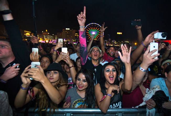 Attendees are excited to see The Weeknd perform on the Downtown Stage during the opening day of the Life is Beautiful Festival on Friday, October 24, 2014.