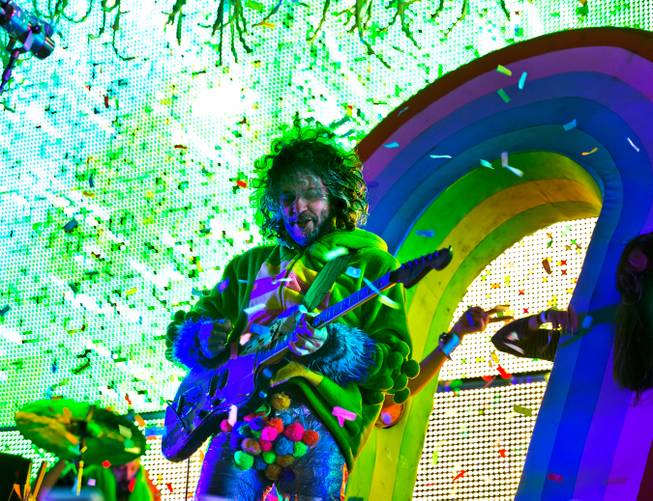 Mark Coyne of The Flaming Lips entertains an energetic crowd as they perform on the Ambassador Stage during day 2 of the Life is Beautiful Festival on Friday, October 24, 2014.