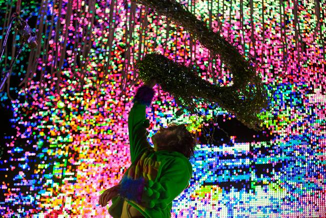 Mark Coyne of The Flaming Lips twirls a silver boa as they perform on the Ambassador Stage during day 2 of the Life is Beautiful Festival on Friday, October 24, 2014