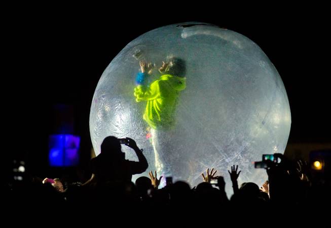 Mark Coyne of The Flaming Lips sings from within a plastic bubble atop the crowd as they perform on the Ambassador Stage during day 2 of the Life is Beautiful Festival on Friday, October 24, 2014.