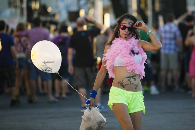 A lady walks down the street in Downtown Las Vegas during Life is Beautiful on Oct. 25, 2014.