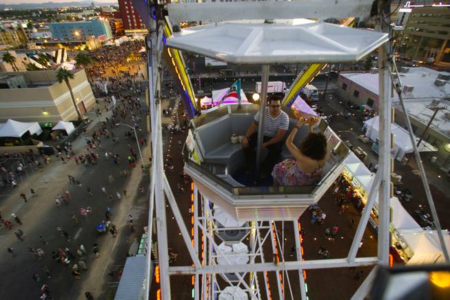 A couple rides the ferris wheel in Downtown Las Vegas for Life is Beautiful from Oct. 26, 2014.