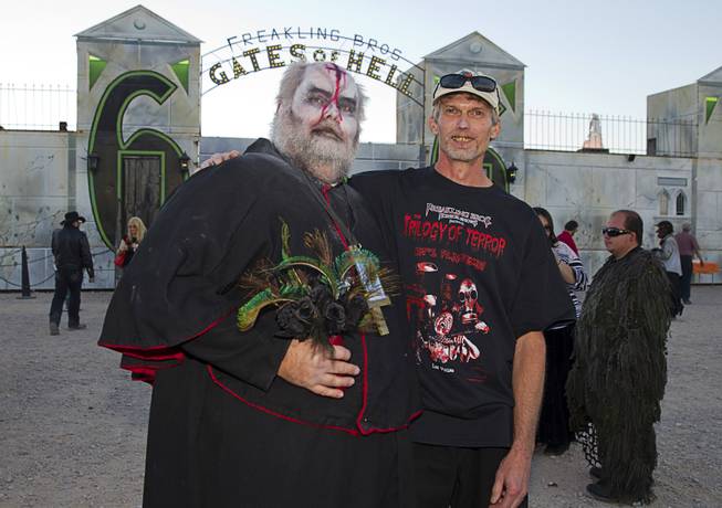 Jeff Burns, left, and his partner Michael Kimball pose after getting married at the Freakling Bros.' Trilogy of Terror haunted house attraction Wednesday, Oct. 29, 2014. Burns is a longtime Freakling Bros. actor who plays Cardinal Sin. Kimball is a former Freakling Bros. actor.