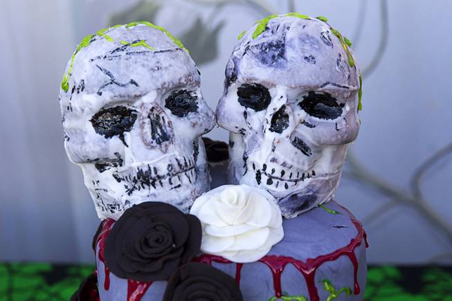 A wedding cake topped with skulls is shown before a wedding at the Freakling Bros.' Trilogy of Terror haunted house attraction Wednesday, Oct. 29, 2014. Jeff Burns aka Cardinal Sin, a longtime Freakling Bros. actor, married Michael Kimball, his longtime partner and a former Freakling Bros. actor.