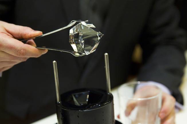 Ryan Nielson, general manager of Bar 3535 and O'Sheas, makes a diamond ice cube during the official opening of the Linq hotel-casino Thursday, Oct. 30, 2014. The property, formerly the Imperial Palace and The Quad, is in the process of a $223 million renovation.