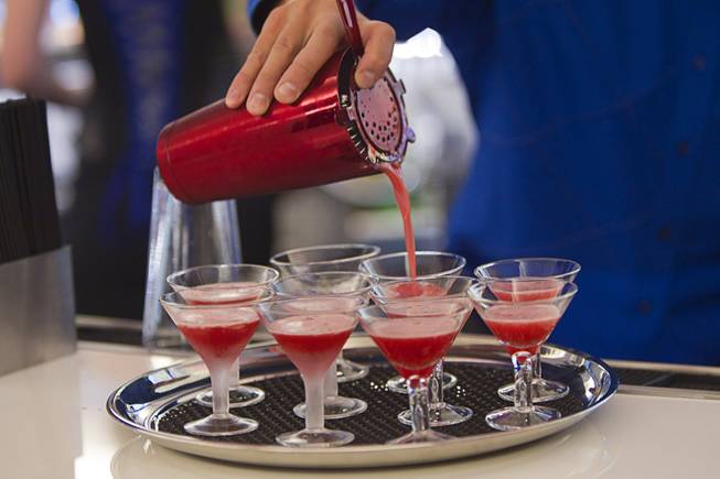 Bartender Mark Kiyojima makes samples of Blackberry Bite cocktails at Bar 3535 during the official opening of the Linq hotel-casino Thursday, Oct. 30, 2014. The property, formerly the Imperial Palace and The Quad, is in the process of a $223 million renovation.