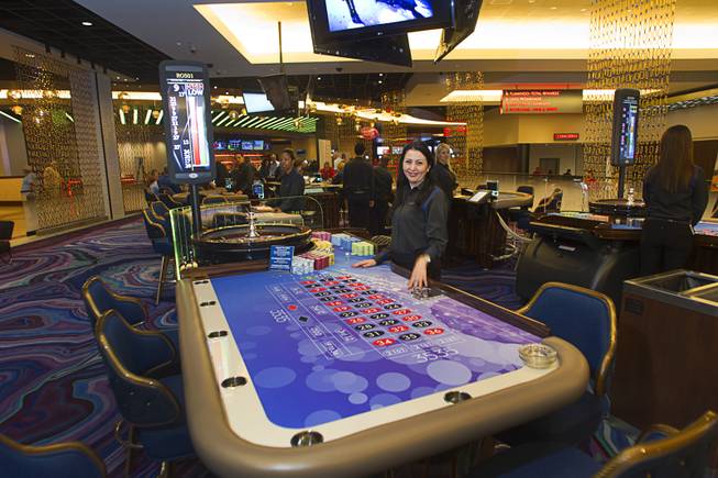 Dealer Karine Martirosyan waits for players at her roulette table during the official opening Thursday, Oct. 30, 2014, of the Linq Hotel. The property, formerly Imperial Palace and the Quad, is in the process of a $223 million renovation.