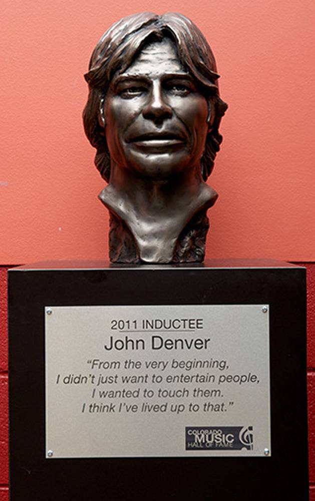 In this May 2011 handout photo, made available on Oct. 30, 2014, by the Colorado Music Hall of Fame, a bust of the late Colorado musician John Denver sits on the induction wall at the Colorado Music Hall of Fame Museum at the 1st Bank Center in Broomfield, Colo.