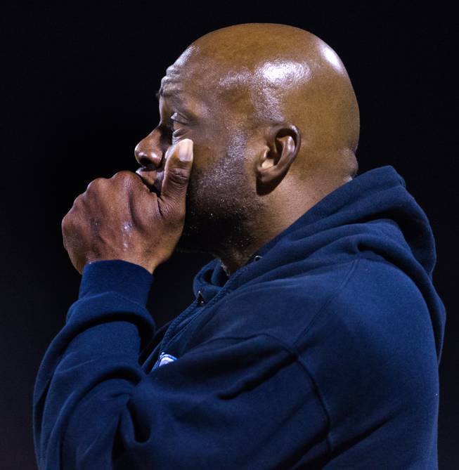 Centennial head coach Leon Evans is a bit contemplative on the sideline during their game versus Arbor View on Thursday, October 30, 2014.