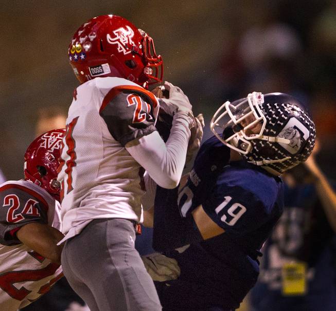 Arbor View's Charles Louch 21 intercepts the ball from Centennial's Andre Meiers 19 on Thursday, October 30, 2014.
