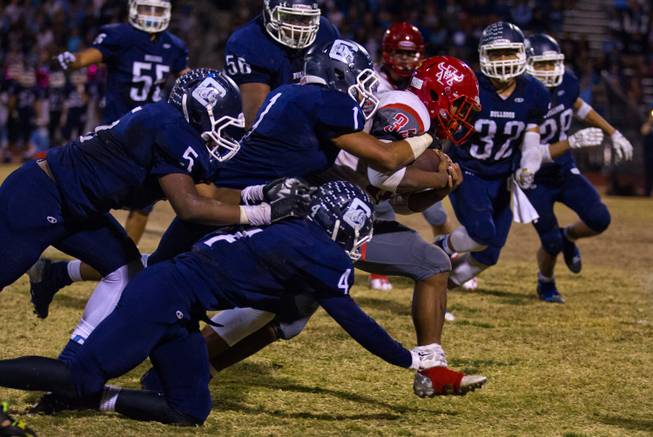 Arbor View's Herman Gray 34 does his best to secure the ball late in the game versus Centennial on Thursday, October 30, 2014.