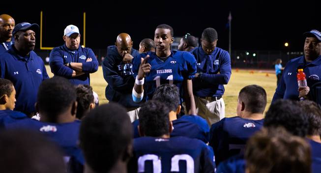 Centennial's Savon Scarver 11 cheers up his teammates by telling them they are still in the hunt after losing to Arbor View 21-16 on Thursday, October 30, 2014.