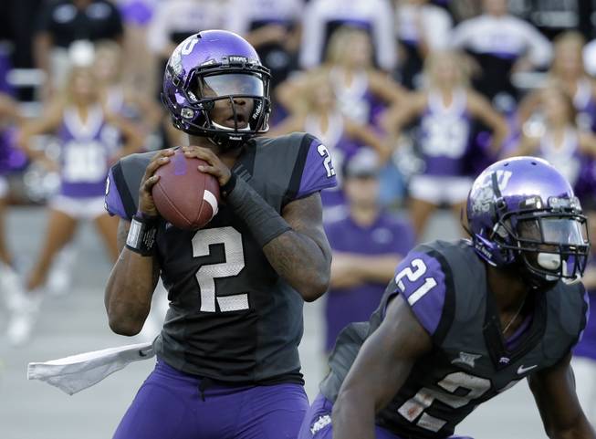 TCU quarterback Trevone Boykin (2) drops back to pass against Texas Tech on Oct. 25, 2014, in Fort Worth.