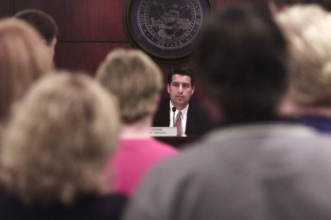 Chairman of the Nevada Gaming Commission Brian Sandoval listens as culinary workers and union representatives petition the commission to enact employment protection for the employees of the Santa Fe hotel-casino Thursday, September 28, 2000. Station Casinos, which has recently purchased the Santa Fe, plans to release all employees from the Santa Fe and either transfer workers from their other properties or rehire the Santa Fe workers.  SAM MORRIS / LAS VEGAS SUN