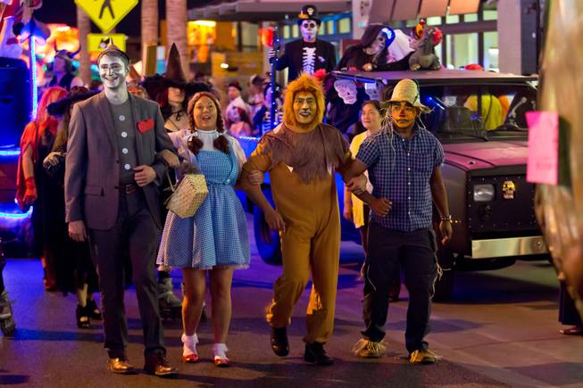 Participants in costume march down Fremont Street during the 2014 Las Vegas Halloween Parade, Friday Oct. 31, 2014.
