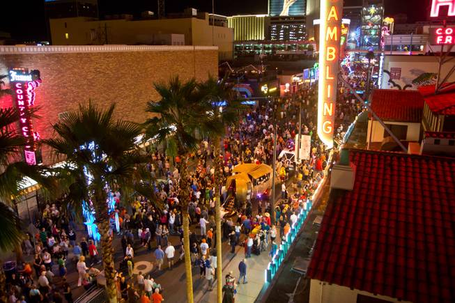 Thousands of people party on Fremont East during the 2014 Las Vegas Halloween Parade, Friday Oct. 31, 2014.