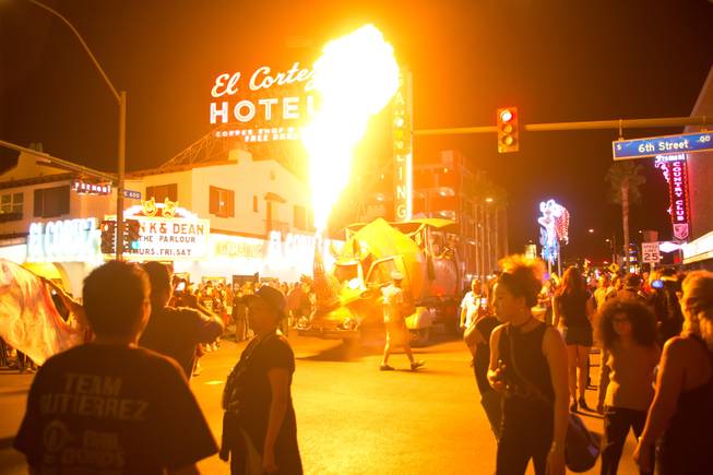 A giant scrap-metal rhino breathes fire during the 2014 Las Vegas Halloween Parade, Friday Oct. 31, 2014.