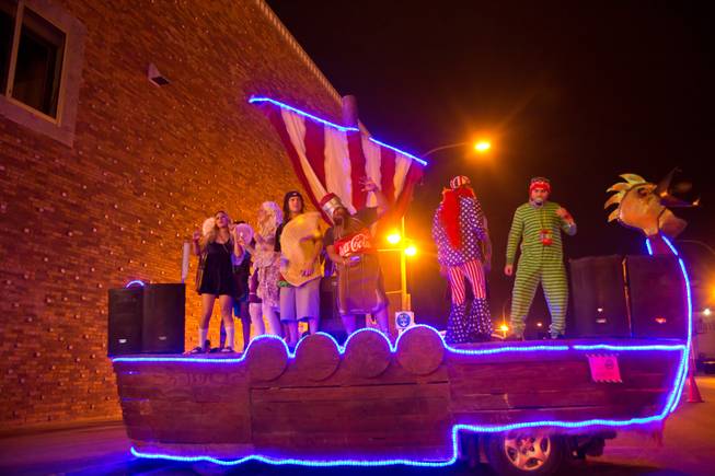Party-goers dance on a boat during the 2014 Las Vegas Halloween Parade, Friday Oct. 31, 2014.