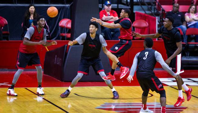 The UNLV basketball team's Jerome Seagears #20 catches some air while making a late pass during a scrimmage on Saturday, November 1, 2014.