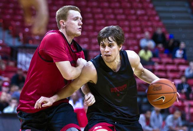 The UNLV basketball team's Dantley Walker #30 defends against teammate Cody Doolin #45 during a scrimmage on Saturday, November 1, 2014.