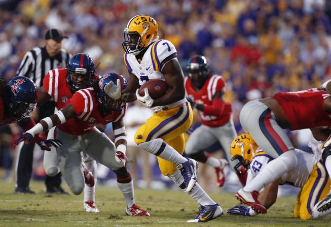 LSU running back Leonard Fournette (7) carries in the first half of an NCAA college football game against Mississippi in Baton Rouge, La., Saturday, Oct. 25, 2014. (AP Photo/Jonathan Bachman)