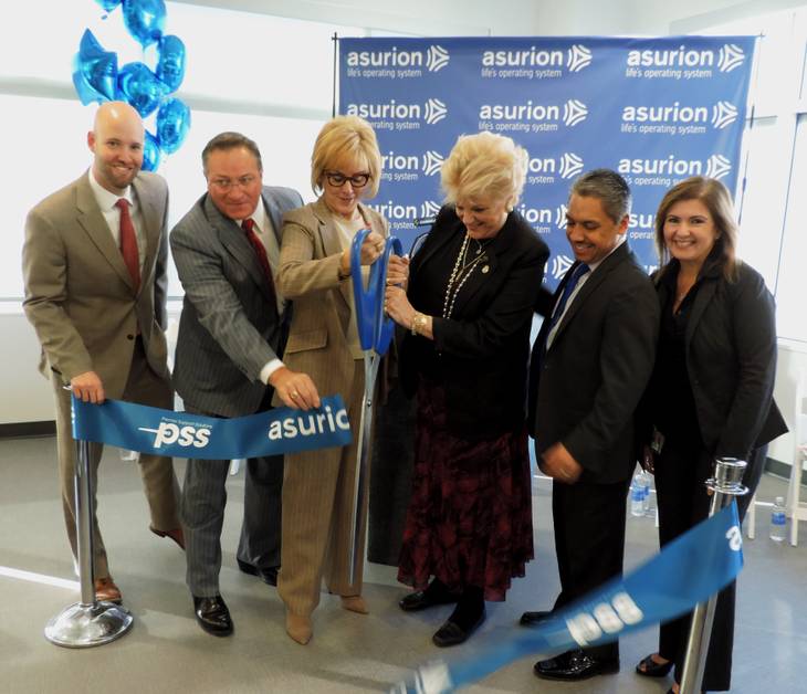 Government officials, including Las Vegas Mayor Carolyn Goodman, celebrate the grand opening of Asurion.
