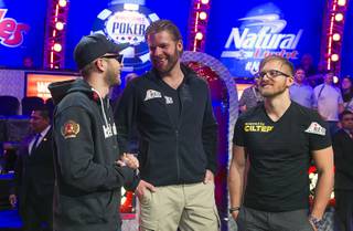 Finalists Felix Stephensen, 24, of Norway, Jorryt Van Hoof, 31, of the Netherlands and Martin Jacobson, 27, of Sweden gather after the first night of play during the 2014 World Series of Poker Main Event Final Table early Tuesday, Nov. 11, 2014, at the Rio. Play continues Tuesday night.