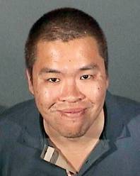 This Nov. 10, 2014, booking photo provided by the Arcadia, Calif., Police Department shows Kwan Chow. Chow, 31, of Monterey Park, Calif., was arrested Monday, Nov. 10, on suspicion of molesting a 10-year-old boy in the restroom of a Dave and Busters restaurant in Arcadia, after being chased through the restaurant by the alleged victim's mother and detained by security personnel.