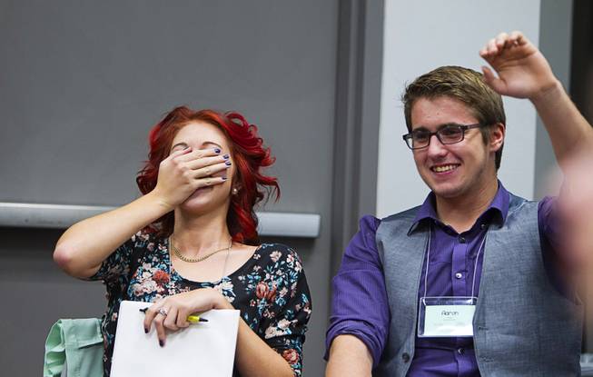 Miranda McGeahy of Southern Nevada High School, and Aaron Palmer of Sierra Vista, laugh during a discussion of marijuana legalization at the 58th annual Las Vegas Sun Youth Forum in the Las Vegas Convention Center Thursday, Nov. 13, 2014.