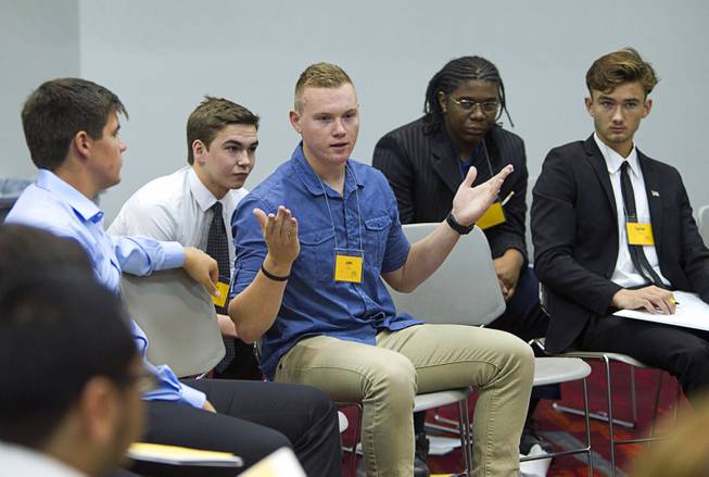 John Cole, center, of Sierra Vista High School gives his opinion during the 58th annual Las Vegas Sun Youth Forum at the Las Vegas Convention Center Thursday, Nov. 13, 2014.