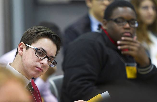 Zil Romero, left, of Coronado High School listens to a discussion during the 58th annual Las Vegas Sun Youth Forum at the Las Vegas Convention Center Thursday, Nov. 13, 2014.