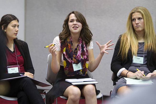Angel Edwards-Fort, center, of Eldorado High School, speaks during a discussion on teen suicide at the 58th annual Las Vegas Sun Youth Forum in the Las Vegas Convention Center Thursday, Nov. 13, 2014.