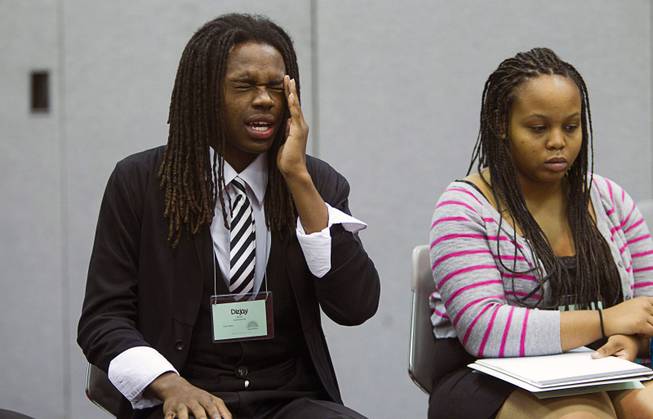 Dizjay Blount of Centennial High School reacts to a comment during the 58th annual Las Vegas Sun Youth Forum at the Las Vegas Convention Center Thursday, Nov. 13, 2014. Clarissa Scott of Bonanza High School is at right.