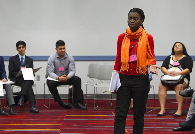Llona Kavege of Valley High School leads a discussion on immigration during the 58th annual Las Vegas Sun Youth Forum at the Las Vegas Convention Center Thursday, Nov. 13, 2014.