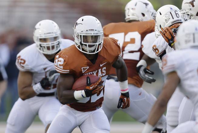 Texas running back Jonathan Gray (32) carries the ball during the NCAA college football team's spring game, Saturday, March 30, 2013, in Austin, Texas. (AP Photo/Eric Gay)