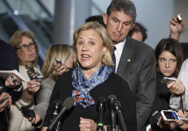 Sen. Mary Landrieu, D-La., chair of the Senate Energy Committee, with Sen. Joe Manchin, D-W. Va., a member of the committee, speak to reporters about the new urgency to get congressional approval for the Canada-to-Texas Keystone XL pipeline, at the Capitol in Washington, Wednesday, Nov. 12, 2014. 