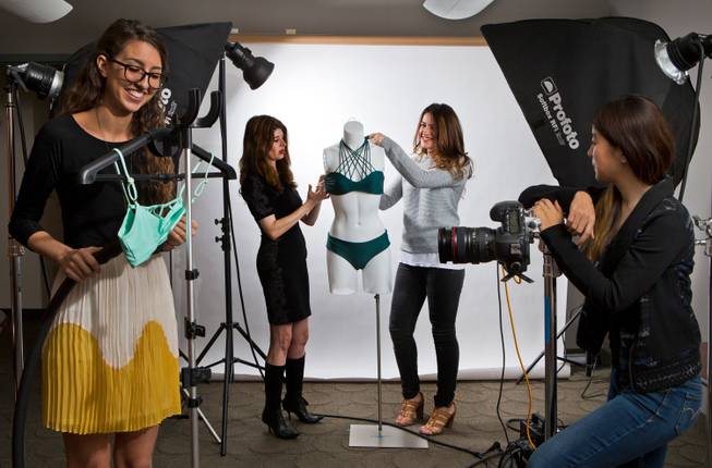 Staffers at Bikini.com use their office studio space to capture their products as an online retailer that has "pop-up" shops at some of the most popular day clubs along the Strip, Friday, Nov. 16, 2014.