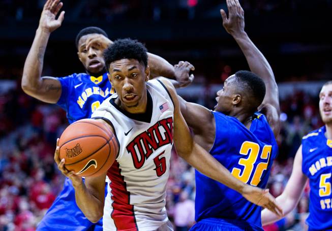 UNLV's Christian Wood #5 secures a loose ball from Morehead State defenders during their home opener on Friday, November 14, 2014.