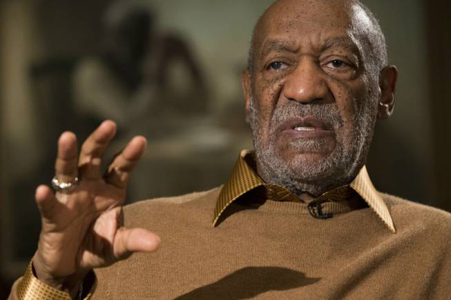 Entertainer Bill Cosby gestures during an interview about the exhibit "Conversations: African and African-American Artworks in Dialogue" at the Smithsonian's National Museum of African Art on Thursday, Nov. 6, 2014, in Washington, D.C.