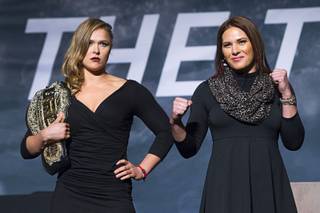 Ronda Rousey, left, UFC womens bantamweight champion and challenger Cat Zingano pose during a UFC news conference at the Smith Center for the Performing Arts Monday, Nov. 17, 2014.