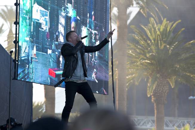 Macklemore performs during the pre-festival at the 2014 Rock n Roll Marathon on Sunday, Nov. 16, 2014, in Las Vegas.