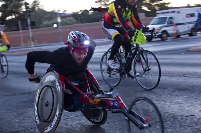 A participant in a specialized wheel chair takes part in the 2014 Rock n Roll Marathon Las Vegas, Sunday Nov. 16, 2014.