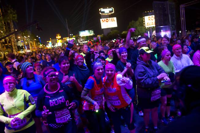 Eager runners wait for their turn to start in the 2014 Rock n Roll Marathon Las Vegas, Sunday Nov. 16, 2014.