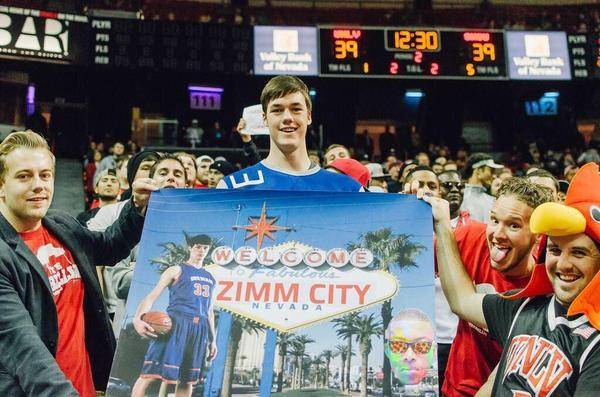 Bishop Gorman senior Stephen Zimmerman stands with a poster of himself in the Rebellion student section Sunday, Nov. 16, 2014, during his official visit to UNLV.