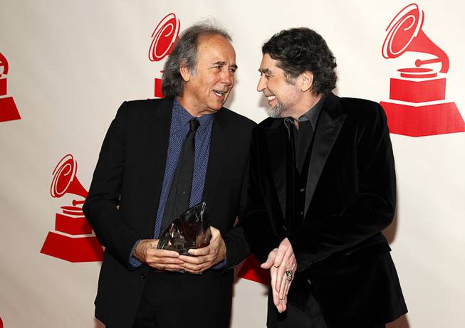 Honoree Joan Manuel Serrat (L) talks with singer/songwriter Joaquin Sabina at the 2014 Latin Recording Academy Person of the Year Tribute to Joan Manuel Serrat at the Mandalay Bay Events Center Wednesday, Nov. 19, 2014.