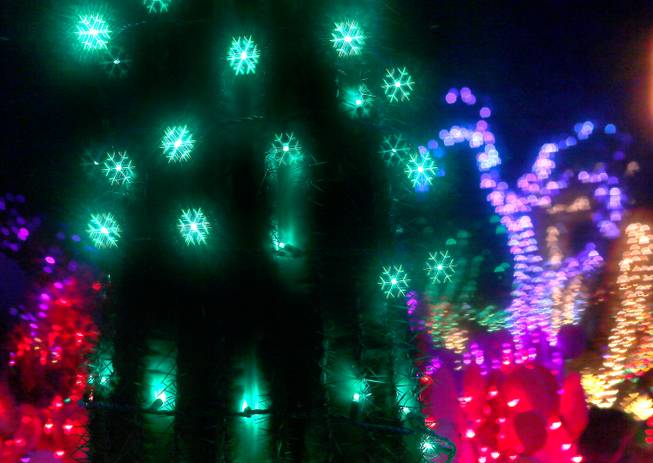 The Cactus Garden at Ethel M Chocolate Factory in Henderson is lit with holiday lights, which can be seen as snowflakes with 3D glasses, on Wednesday, Nov. 19, 2014.