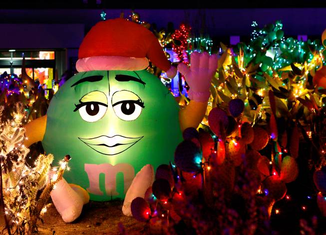 The Cactus Garden at Ethel M Chocolate Factory is lit with holiday lights, including a blow-up M&M, on Wednesday, Nov. 19, 2014, in Henderson.

